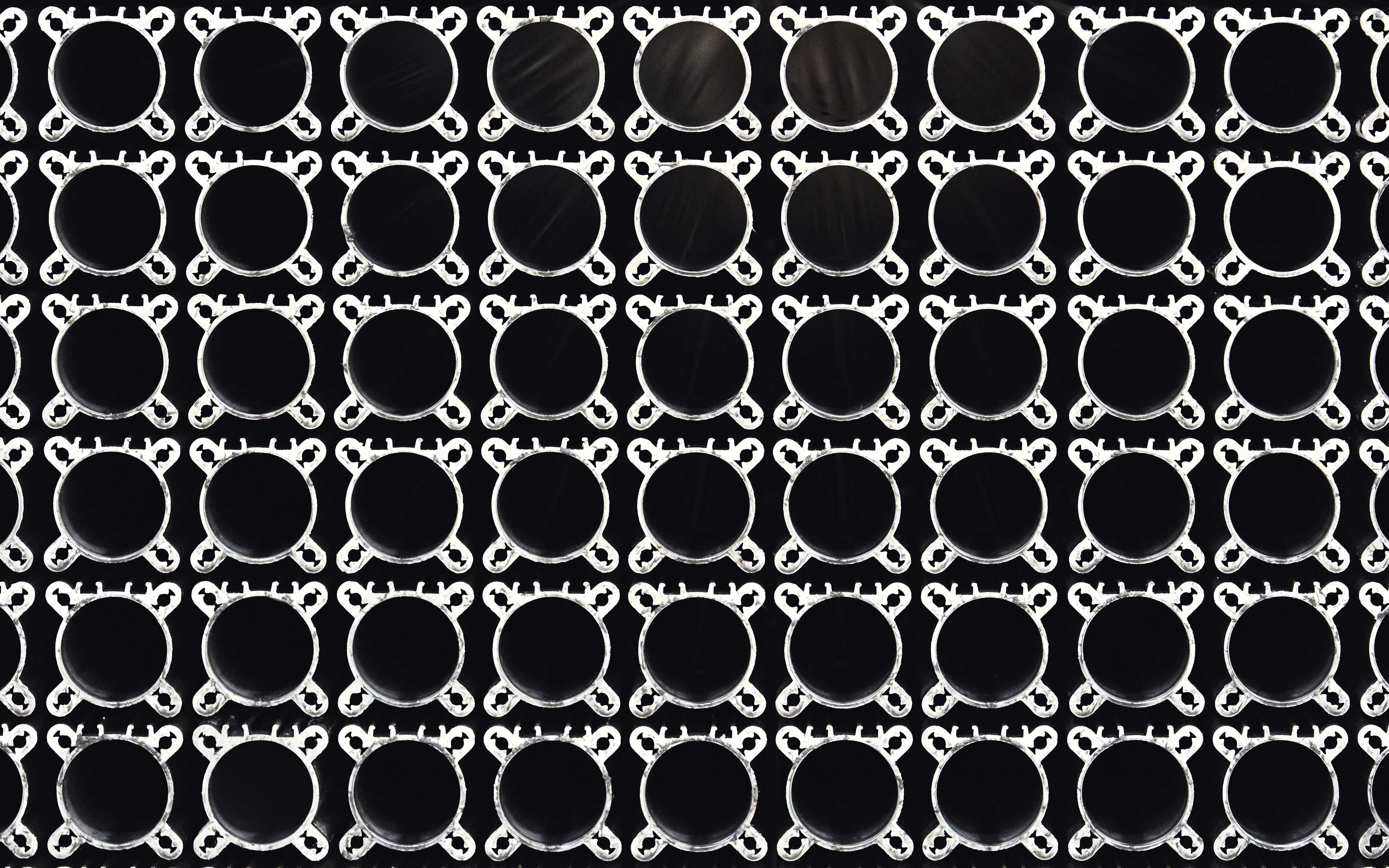 Aluminium profile cross-sections on a black background