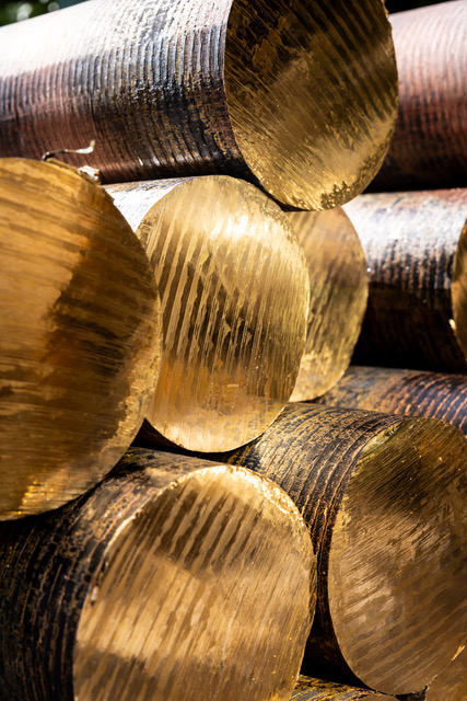 Stacked brass round bar ends